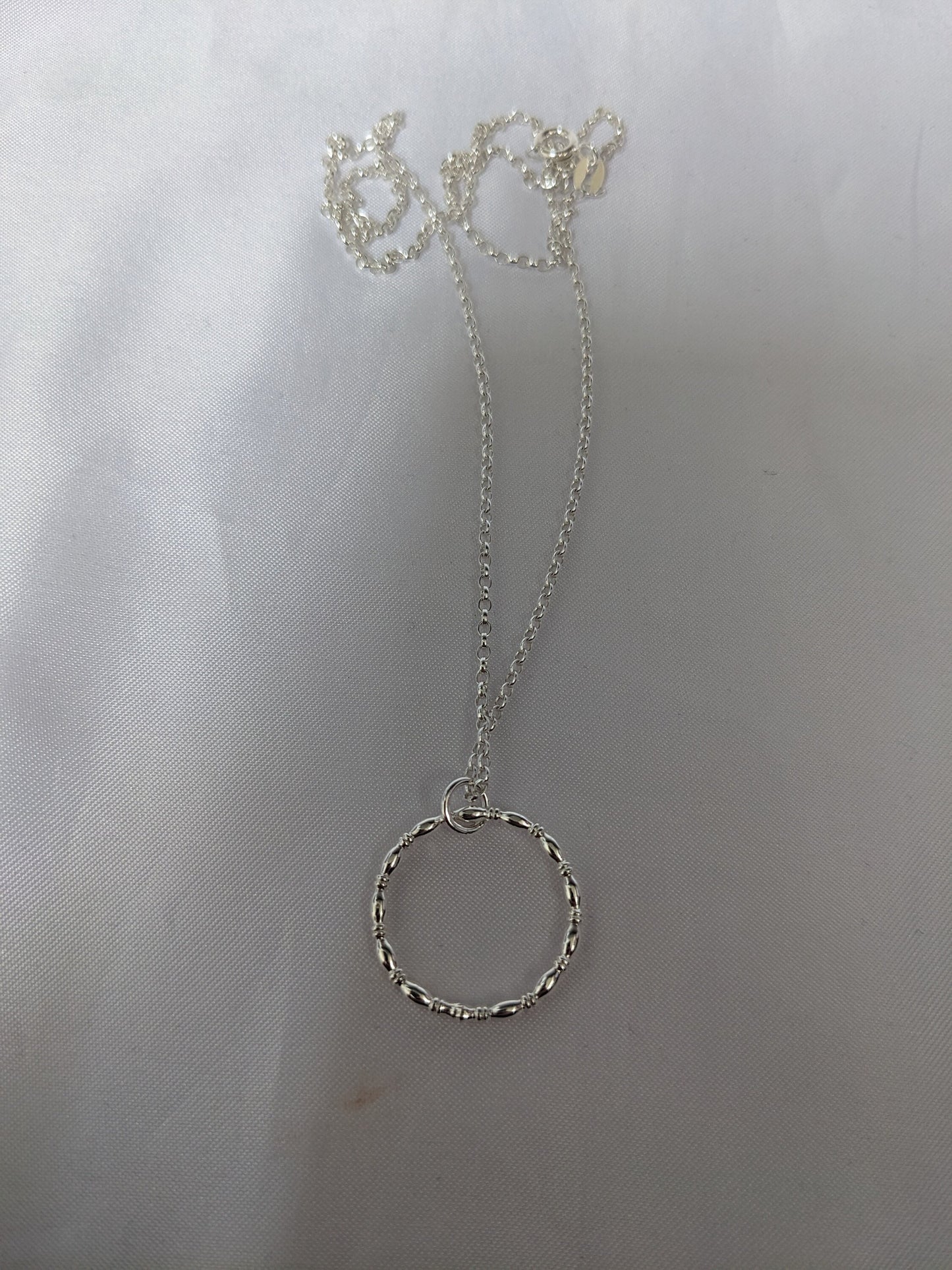 Sterling silver patterned geometric circle tactile necklace, handmade sterling silver pendant