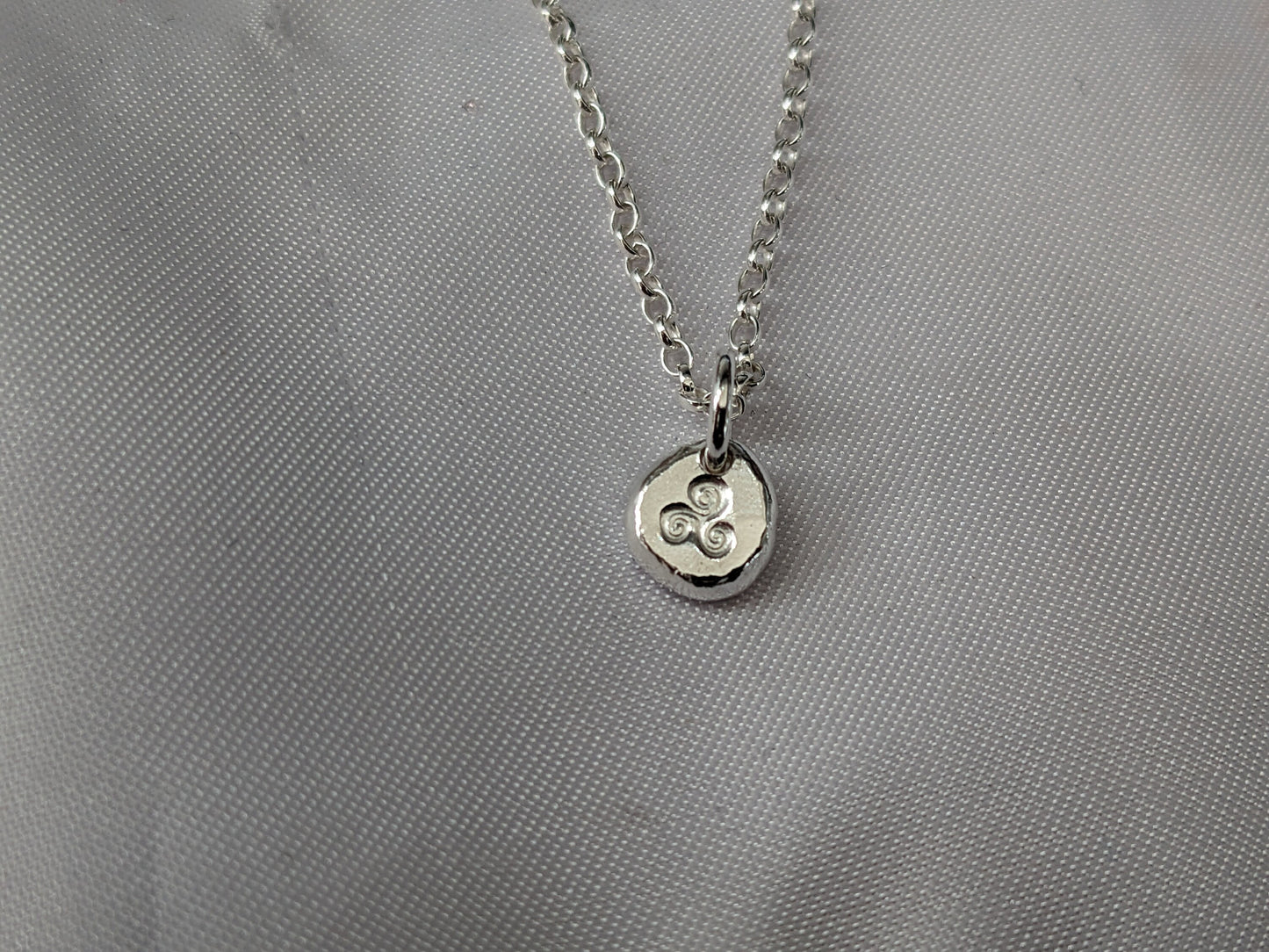 Dainty sterling silver swirl triskele pendant | Organic shaped triskele pebble necklace
