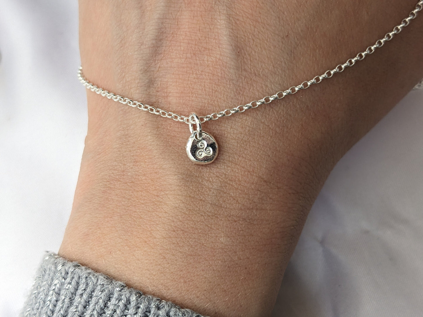 Dainty sterling silver swirl triskele pendant | Organic shaped triskele pebble necklace