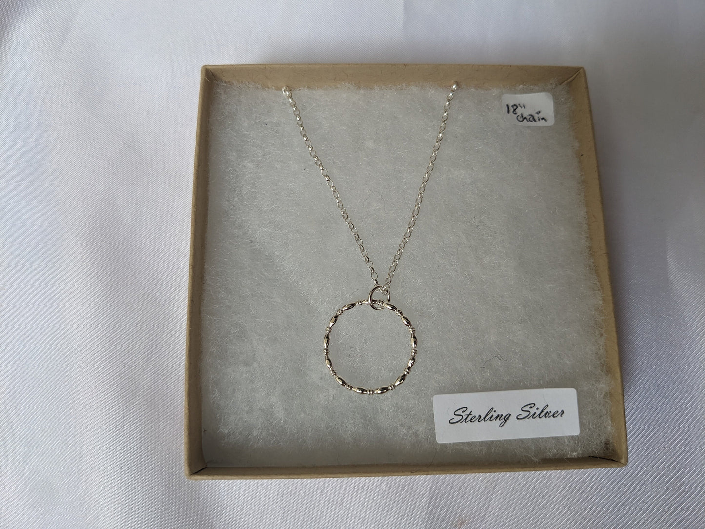 Sterling silver patterned geometric circle tactile necklace, handmade sterling silver pendant