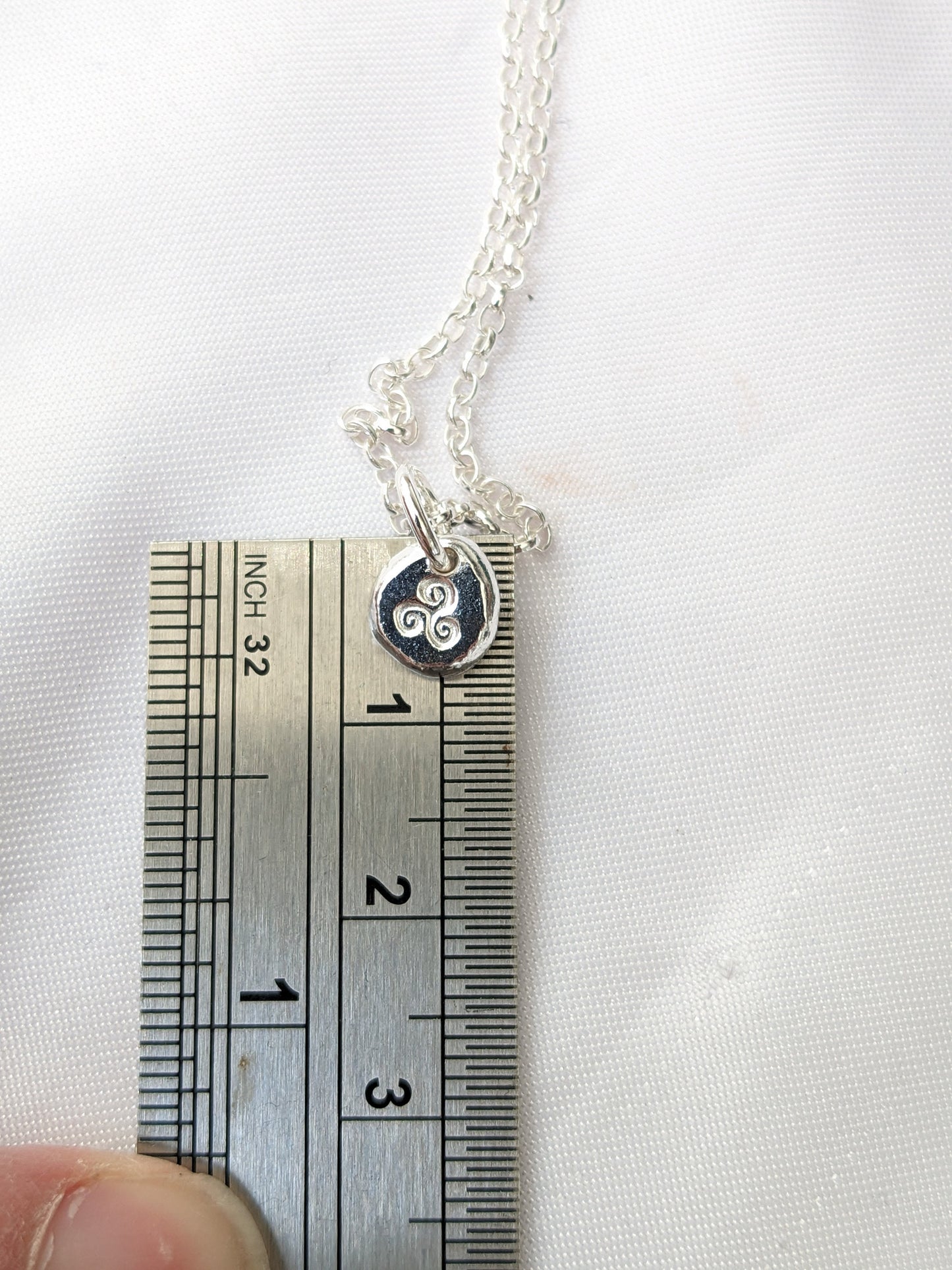 Dainty sterling silver swirl triskele pendant | Organic shaped triskele pebble necklace