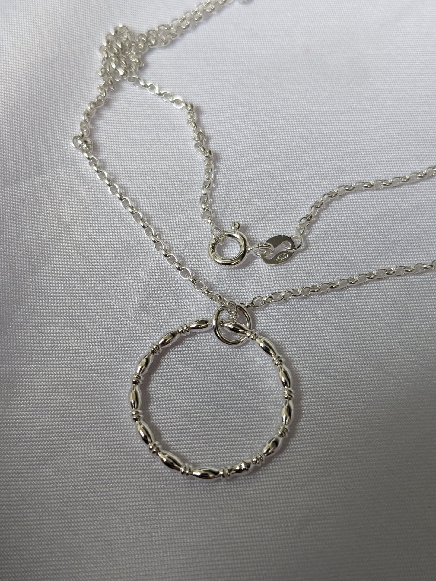 Sterling silver patterned geometric circle tactile necklace, handmade sterling silver pendant