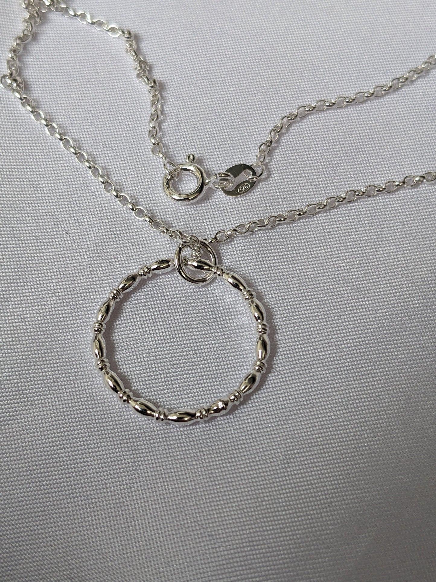 Sterling silver patterned geometric circle tactile necklace, handmade sterling silver pendant