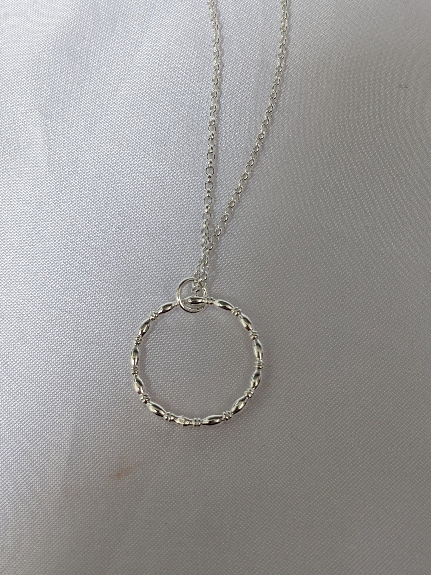 Sterling silver patterned geometric circle tactile necklace, handmade sterling silver pendant