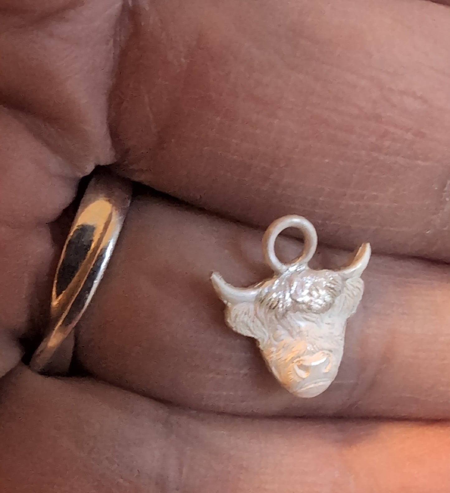Highland Cow Charm Earrings handmade from fine silver on a small sterling silver hoop or hook