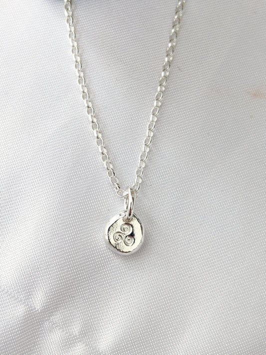 Dainty sterling silver swirl triskele pendant | Organic shaped triskele pebble necklace