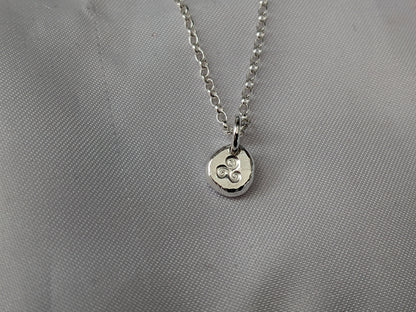 Dainty sterling silver swirl triskele pendant | Organic shaped triskele pebble necklace