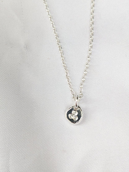 Dainty sterling silver swirl triskele pendant | Organic shaped triskele pebble necklace