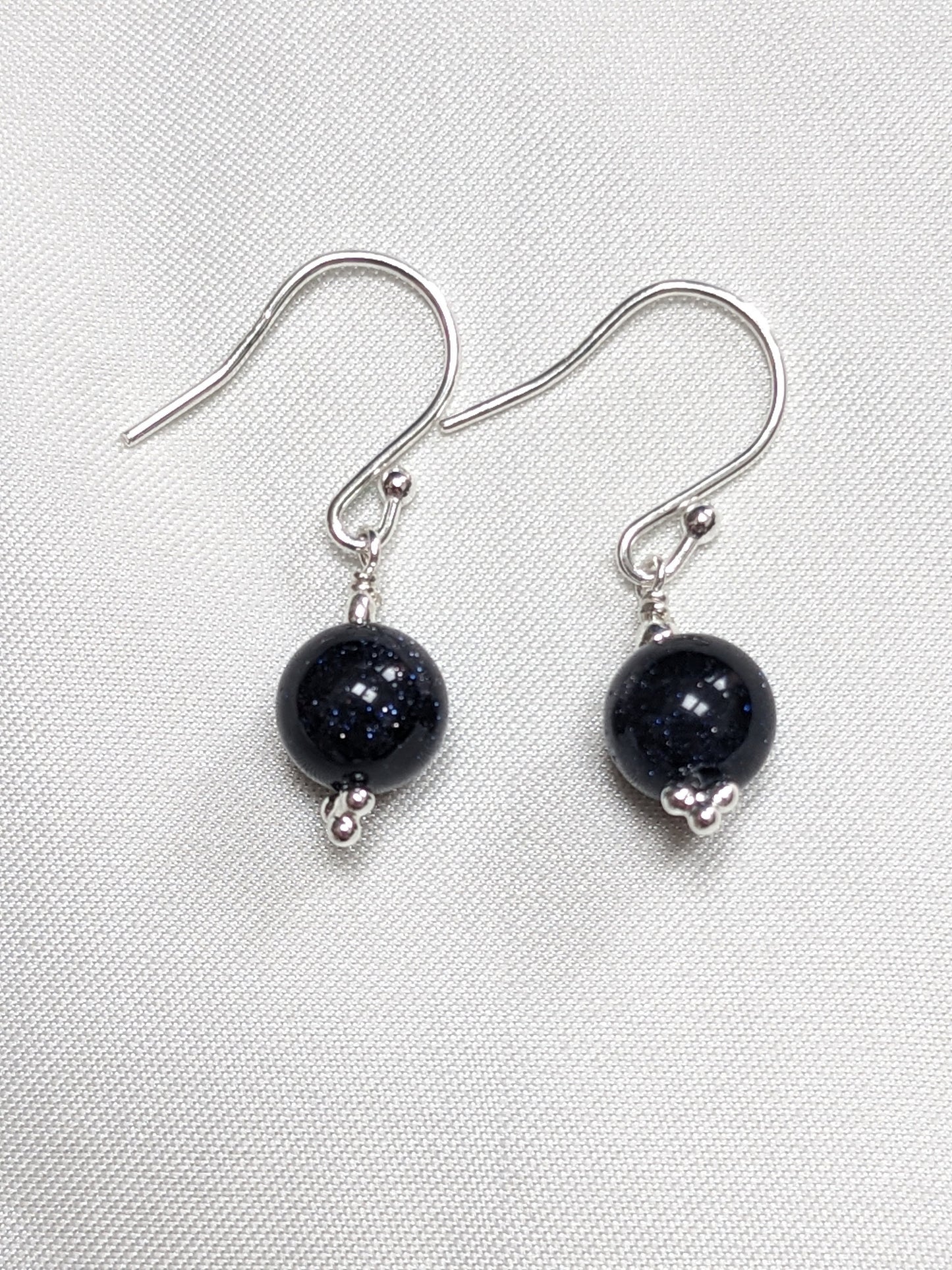 Sterling Silver Earrings with a sparkle blue goldstone bead