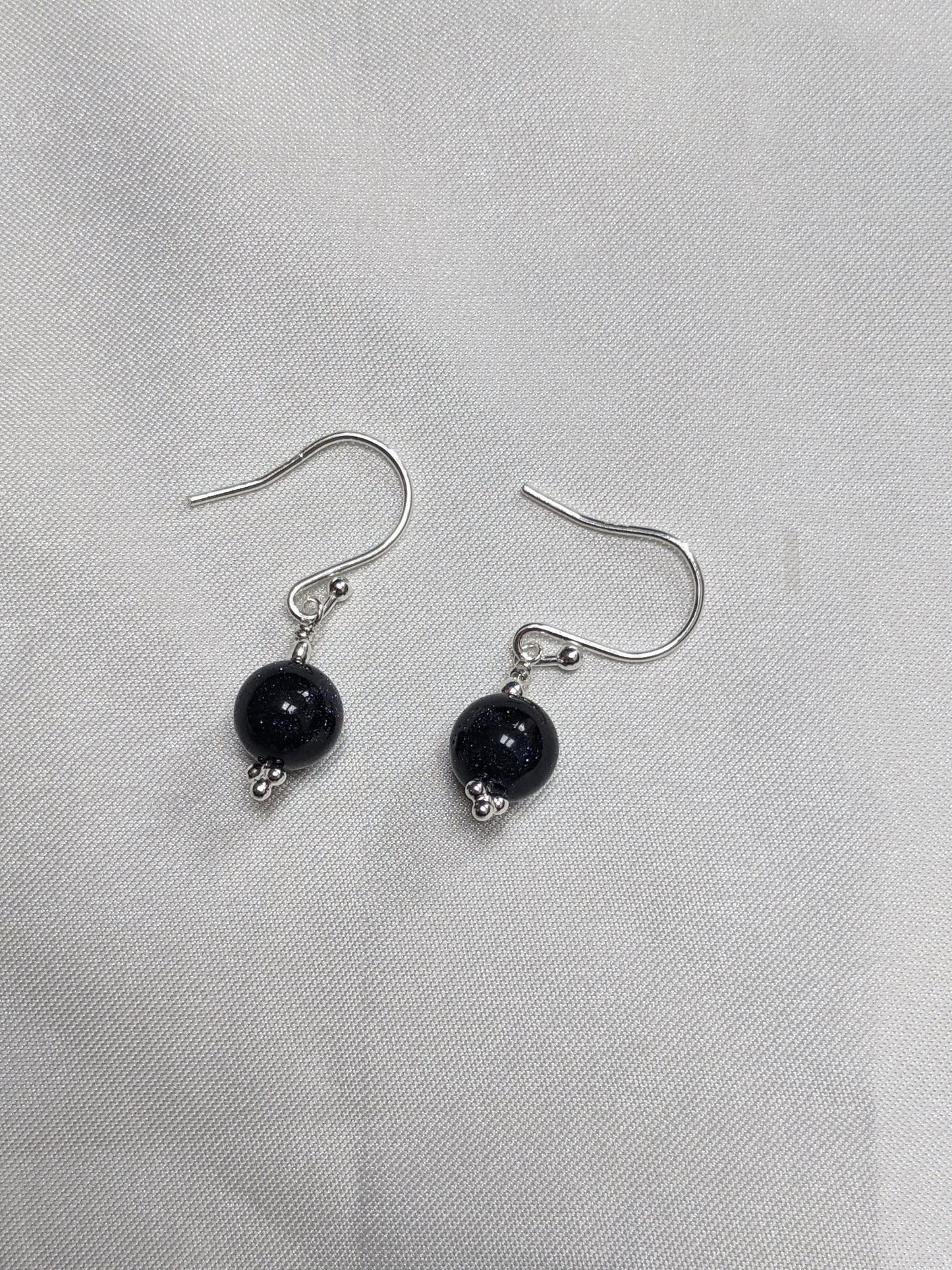 Sterling Silver Earrings with a sparkle blue goldstone bead
