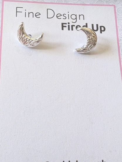 Sterling silver crescent moon handmade stud earrings on backing card