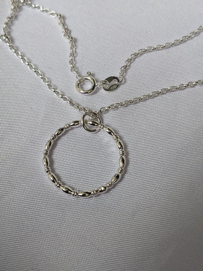 Sterling silver patterned geometric circle tactile necklace, handmade sterling silver pendant