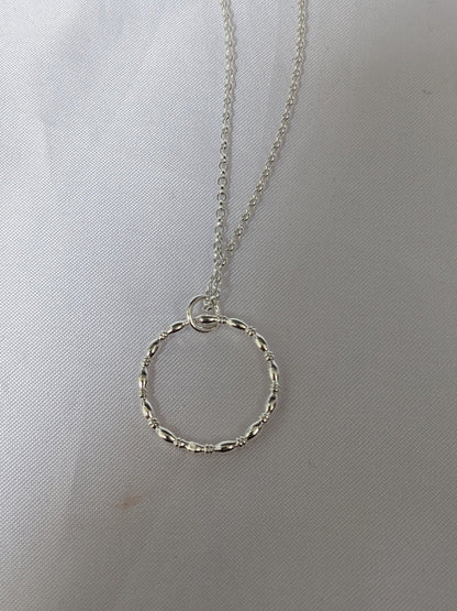 Sterling silver patterned geometric circle tactile necklace, handmade sterling silver pendant