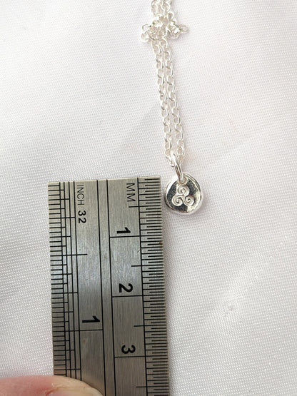 Dainty sterling silver swirl triskele pendant | Organic shaped triskele pebble necklace