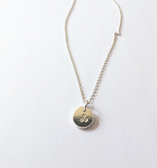 Dainty sterling silver swirl triskele pendant | Organic shaped triskele pebble necklace