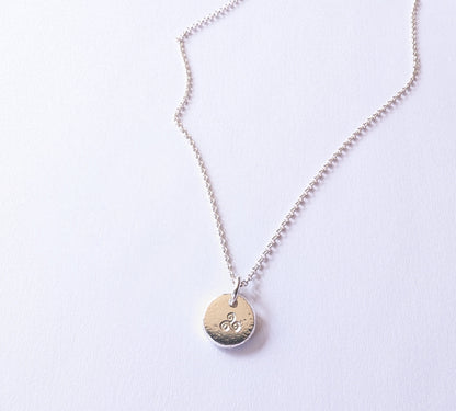 Dainty sterling silver swirl triskele pendant | Organic shaped triskele pebble necklace